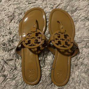 Black patent leather flip flops